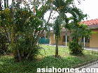 Singapore's older colonial bungalow with large front and back gardens