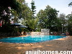 The Palisades - pool and barbecue area facing lush greenery