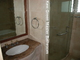 Master bathroom with marble walls, shower stall and long bath