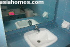 Original wall tiles and bath tubs and sinks of Horizon Towers are deep blue 