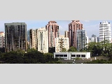 Leonie Towers (extreme right), Overseas Family School, foreground, low rise whte building.