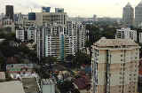 Tan Tock Seng Hospital (logo in building) next to blue Novena subway building