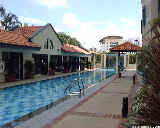 Camelot's lap pool. Gym, management office, barbecue pits on left side. Tennis court right of barbecue pits.