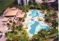 Parc Oasis: Resort pools and lush greenery