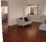 Braddell View: Balcony of living area tiled with teak wood strips