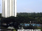 The Waterside - pool and building. Sea & recreational park  in background.